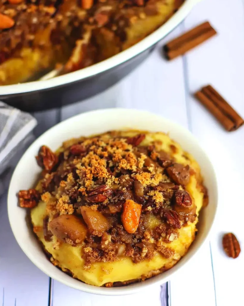 Keto Sweet Potato Casserole: The Best Low-Carb Holiday Side Dish 7 Serving of keto sweet potato casserole with pecan crumble and cinnamon in a white bowl
