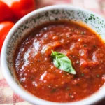Quick Keto Pizza Sauce: The Best Low-Carb Pizza Sauce Recipes & Store-Bought Picks 6 Quick Keto Pizza Sauce served in a ceramic bowl topped with fresh basil